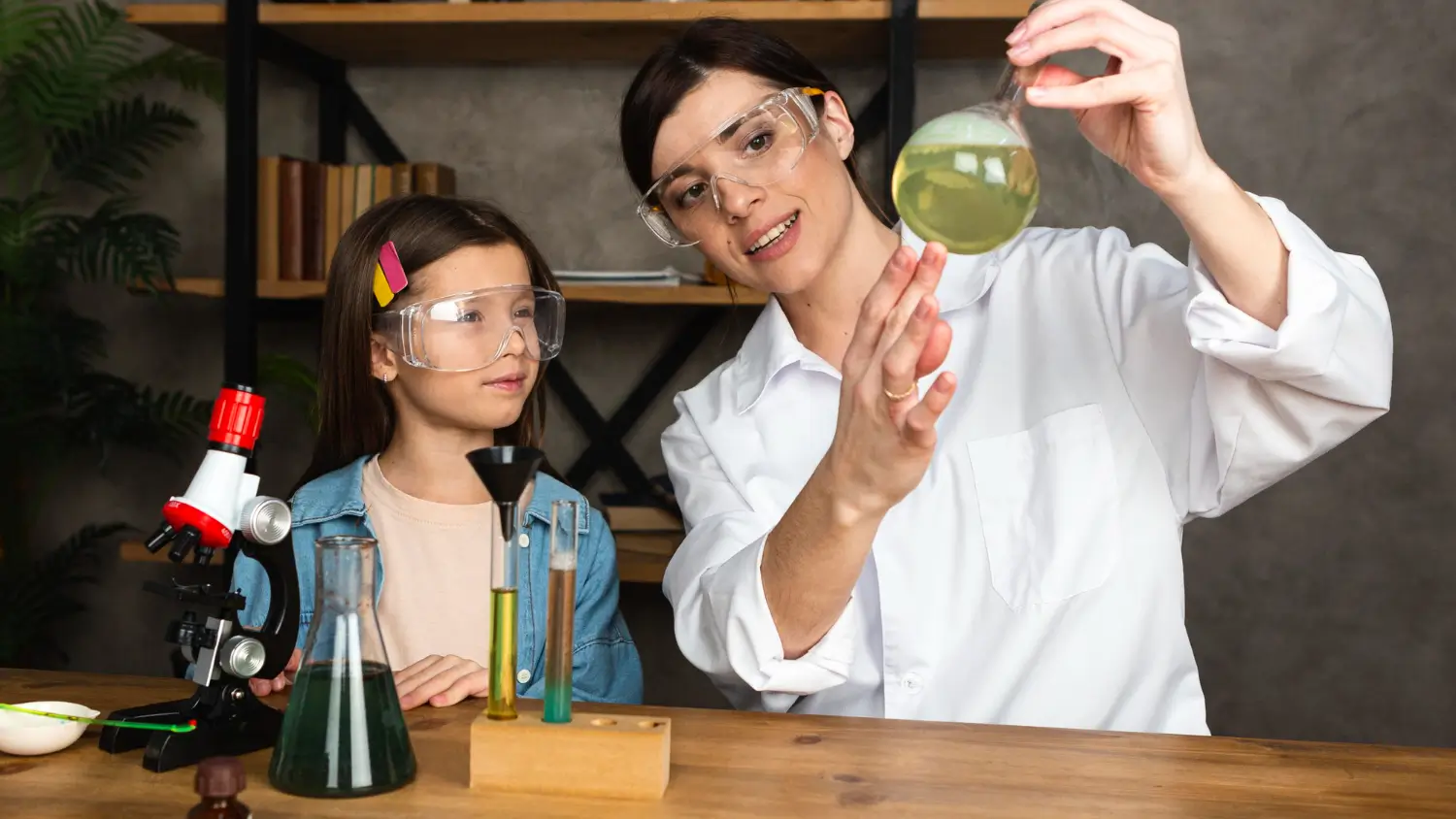 Experienced chemistry tutor explaining molecular structures to a student in Dubai