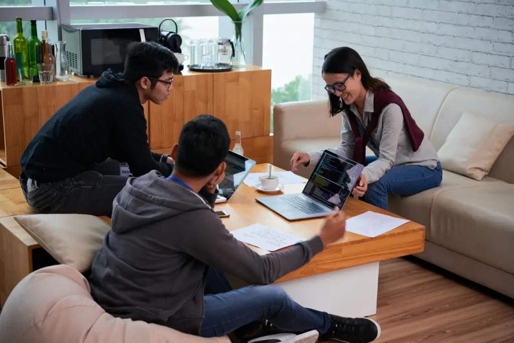 IGCSE Tutor in Dubai teaching two students in a home sitting.