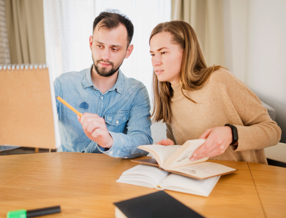 An expert GCSE English tutor in Dubai providing a one-on-one private home tuition session to a student, helping with literary analysis for exam success.