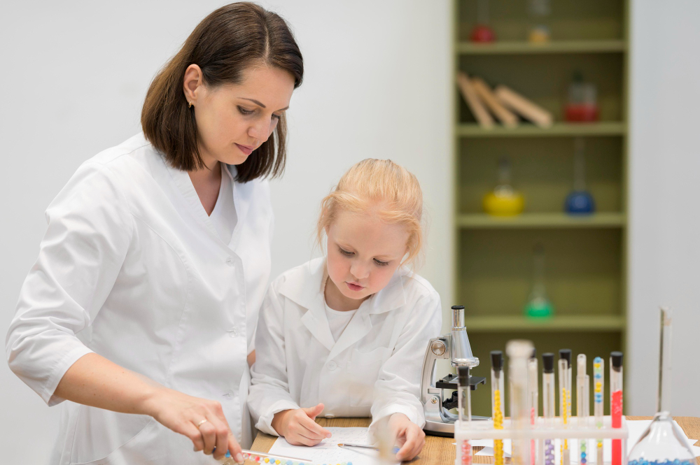 A private IGCSE Chemistry tutor in Dubai providing one-on-one tuition to a student in a home setting, focusing on a chemical equation.
